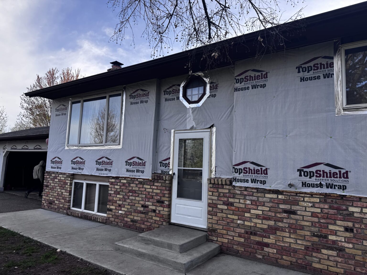 House wrapped in moisture barrier before siding installation, Minnesota